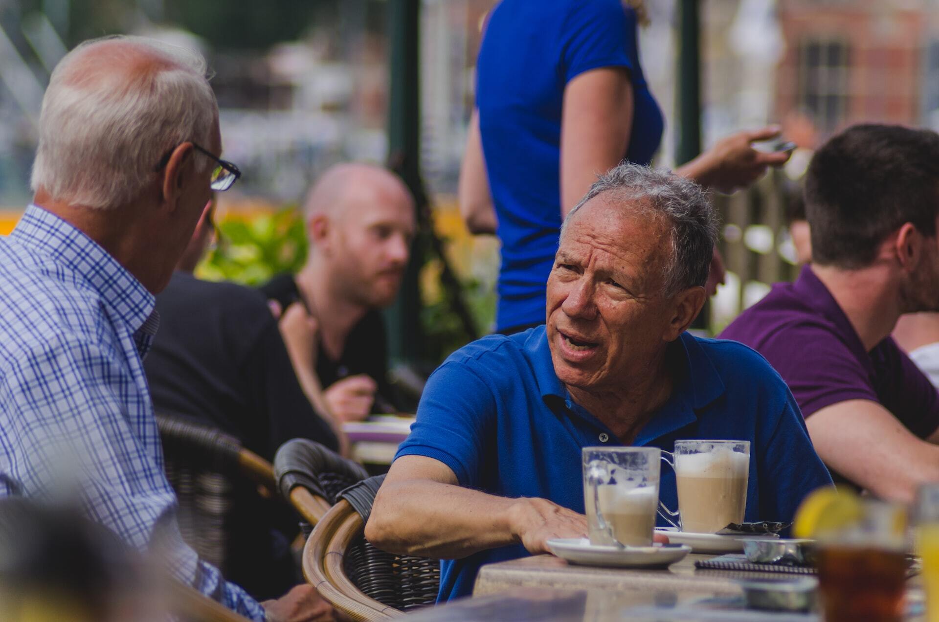 Two dudes enjoying a Coffee on the streets of Amsterdam